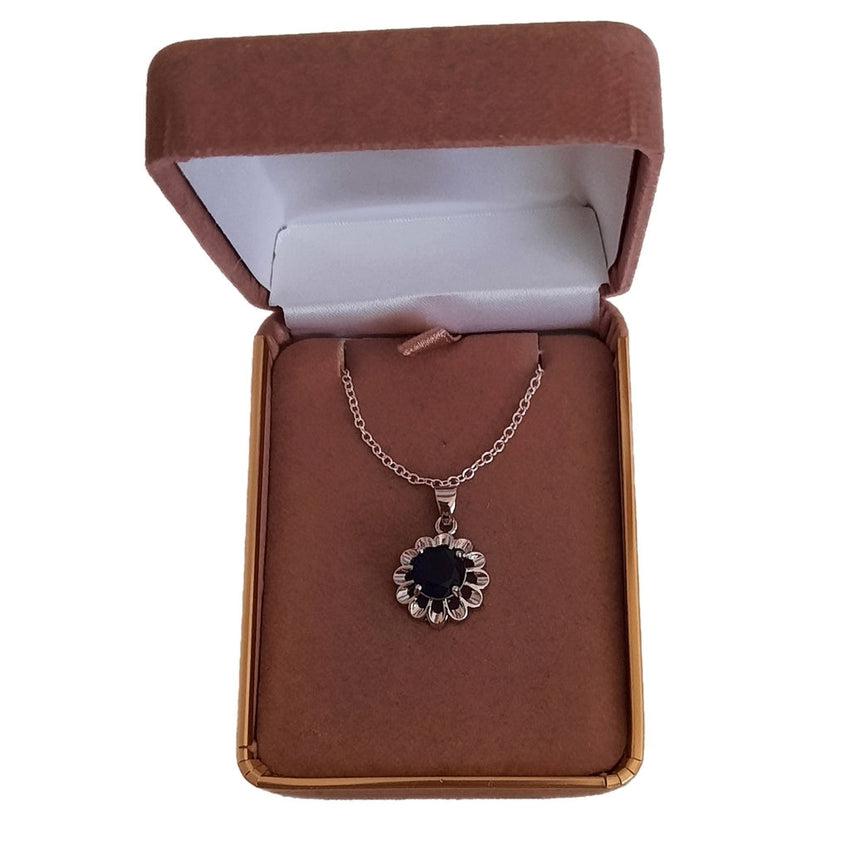 Blue Solitaire Centre Flower Pendant With Open Silver Surround