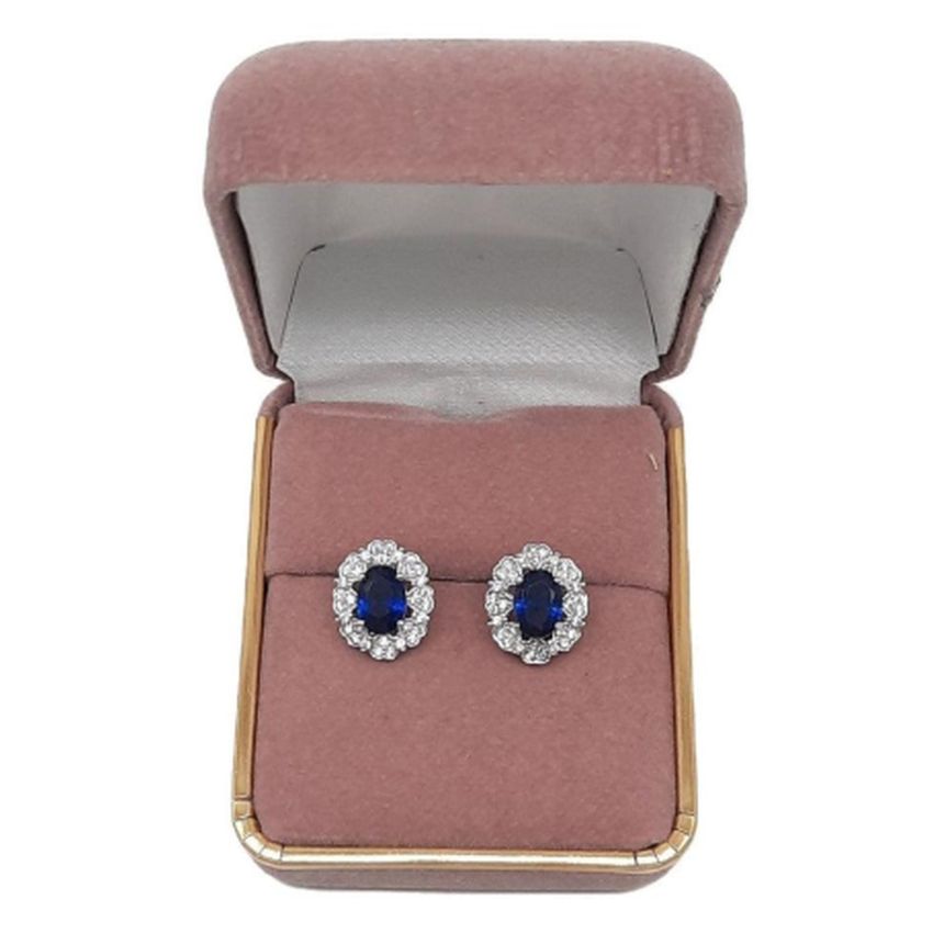 Sterling Silver Blue Centre Flower Earrings with a CZ Surround(2)
