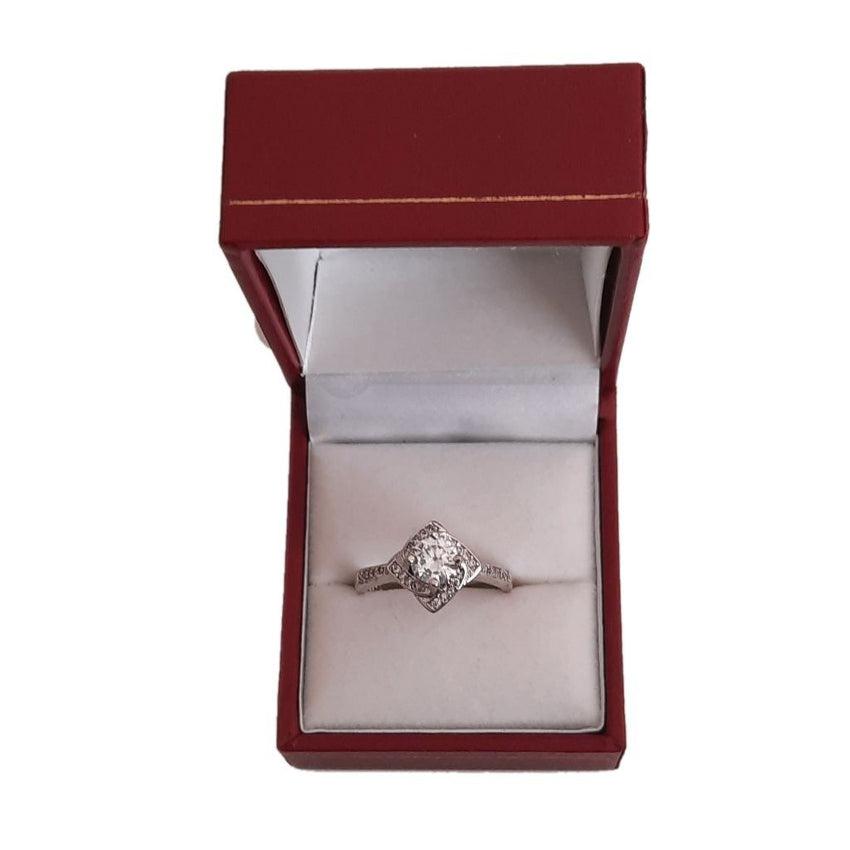 Cubic Zirconia Central Starburst Cushion Ring With a Stone Set Band