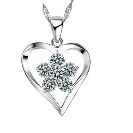 Open Silver Heart Pendant With a Cubic Zirconia Flower Centre Stone