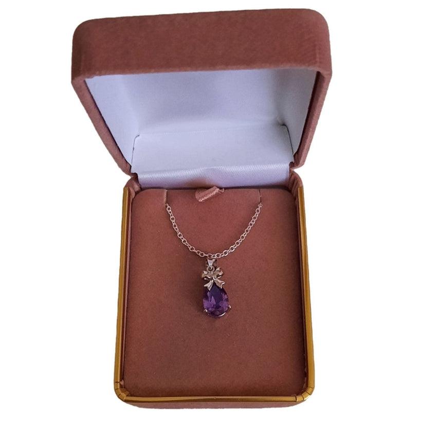 Purple Cubic Zirconia Stone Pendant With a Silver Tied Bow Top