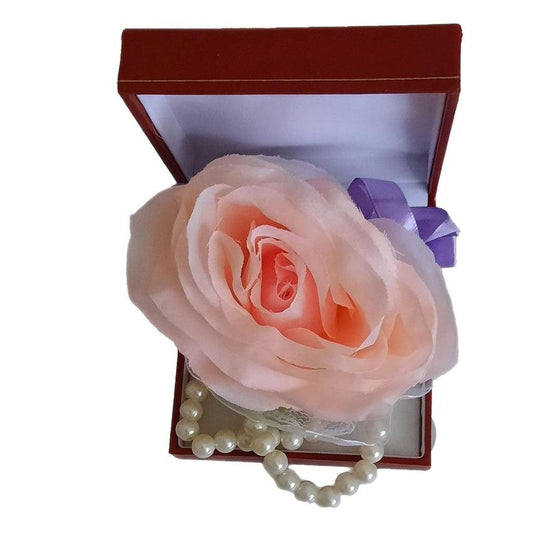 Purple Ribbon With a Pale Pink Rose Wrist Corsage