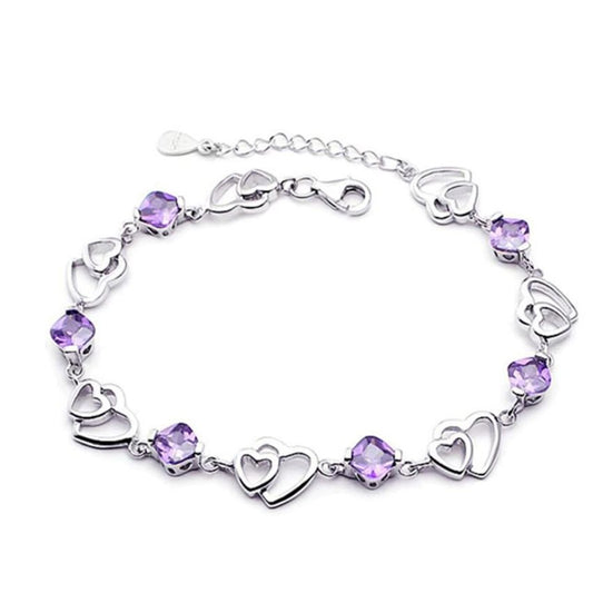 Rhodium Plated Bracelet With Purple Centre Stones