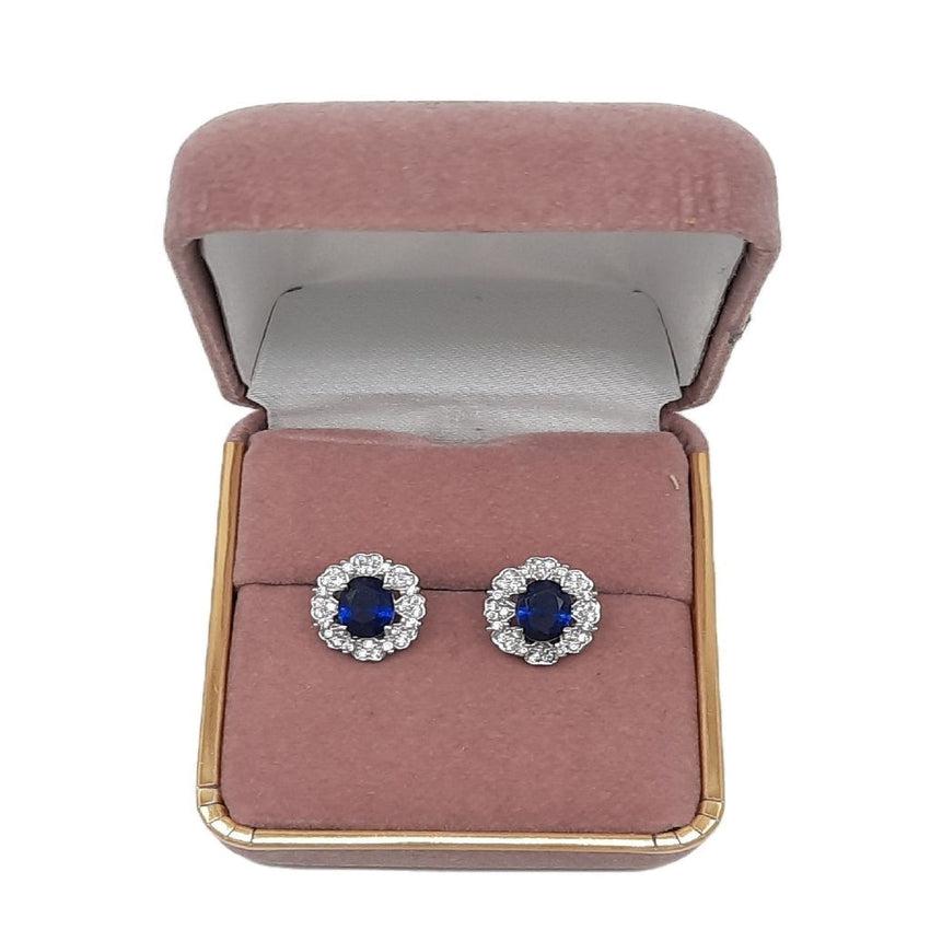 Sterling Silver Blue Centre Flower Earrings with a CZ Surround